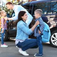 parents dropping off kids for school